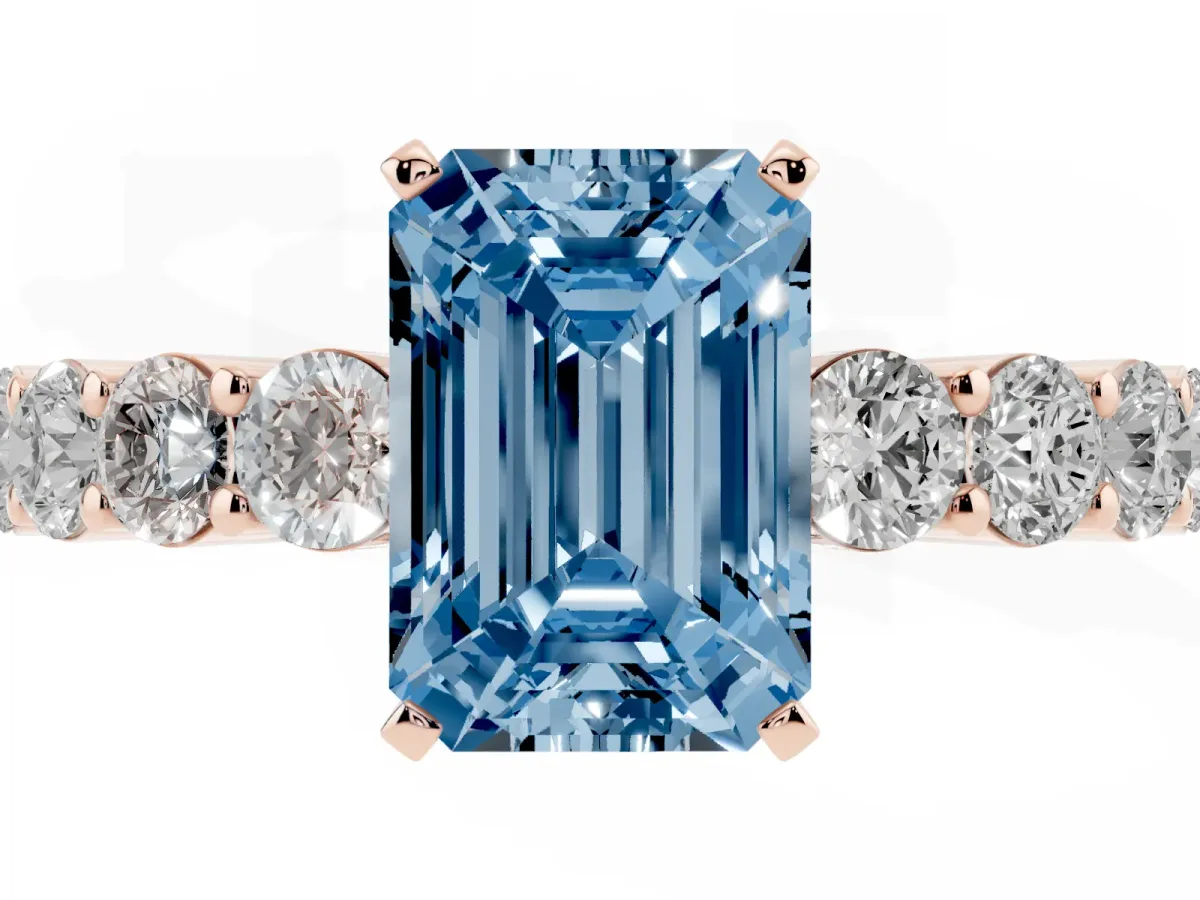 Fancy Blue Emerald Cut Diamond Solitaire Ring with Shared Prong Round Side Stones Rose gold