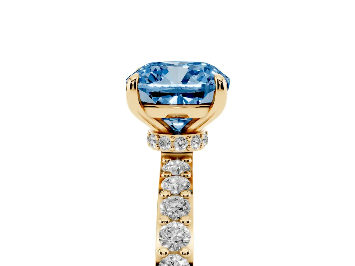 Fancy Blue Cushion Cut Diamond Pavé Engagement Ring with Round Accents and Prong Setting Yellow gold