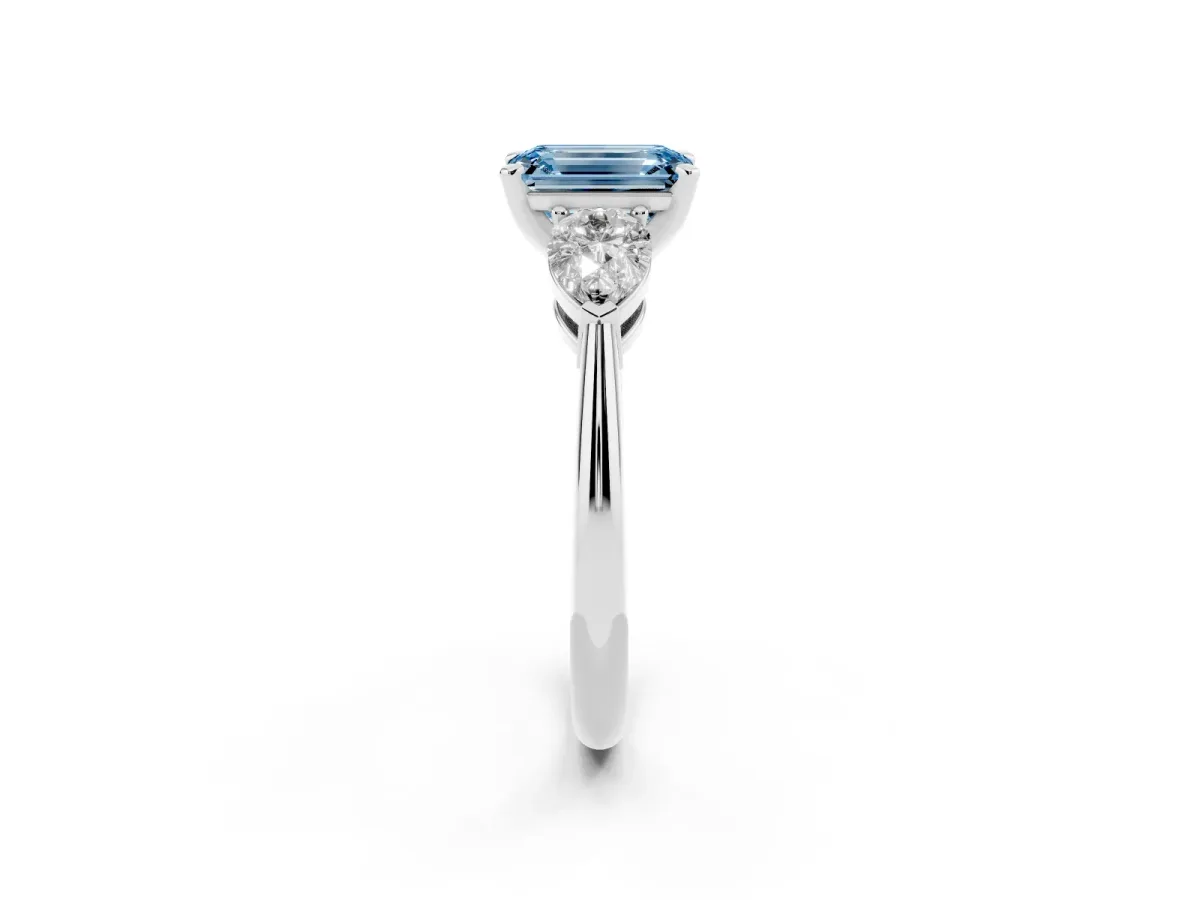 Fancy Blue Three-Stone Emerald Cut Diamond Ring with Pear Side Stones and Four-Prong Setting Platinum