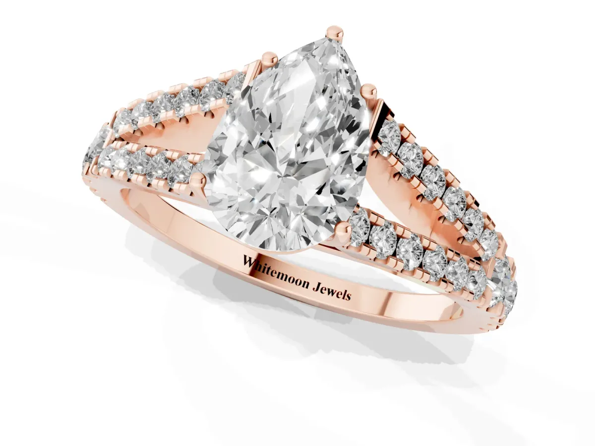 Pear Cut Diamond Split Shank Engagement Ring with Round Pavé and Prong Setting Rose gold