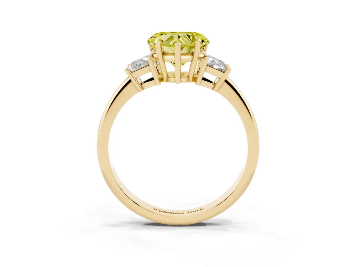 Fancy Yellow Heart Cut Diamond Three-Stone Ring with Trapezoid Side Stones and Prong Setting Yellow gold