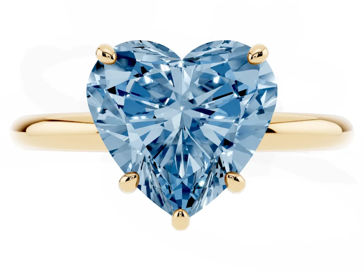 Fancy Blue Heart Cut Solitaire Diamond Ring with Four-Prong Setting on a Plain Band Yellow gold