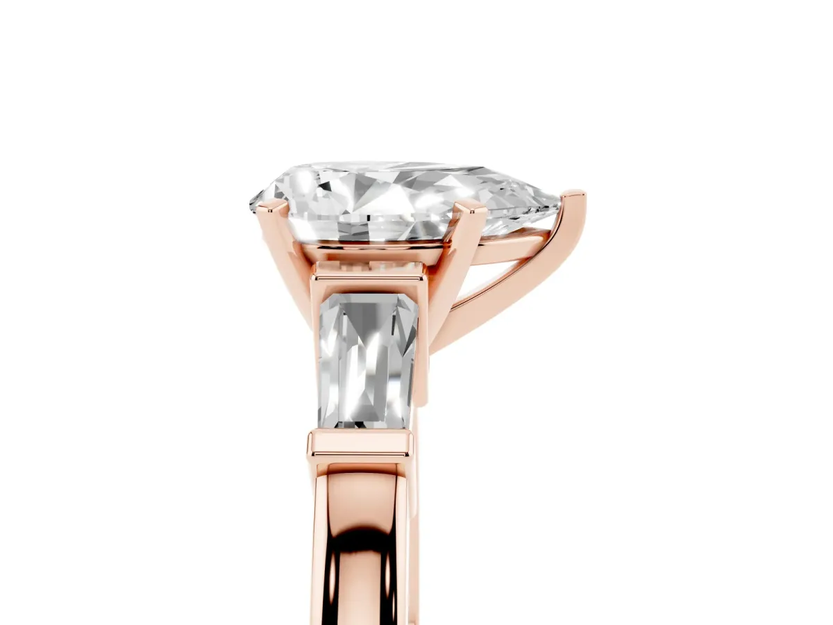 Pear Cut Cut Diamond Solitaire Ring with Tapered Baguette Accents and Four-Prong Setting Rose gold