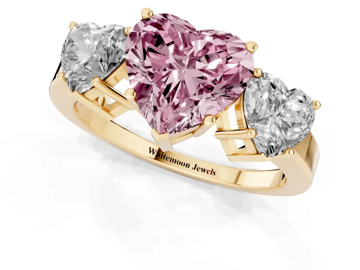 Fancy Pink Three-Stone Heart Cut Cut Diamond Engagement Ring with Flat Band and Four-Prong Setting Yellow gold