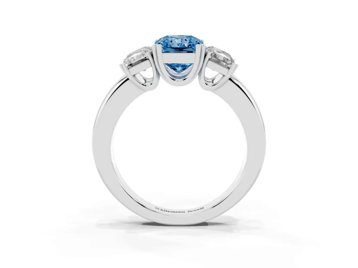 Fancy Blue Three-Stone Radiant Cut Cut Diamond Ring with Channel Set Band and Four-Prong Setting Silver