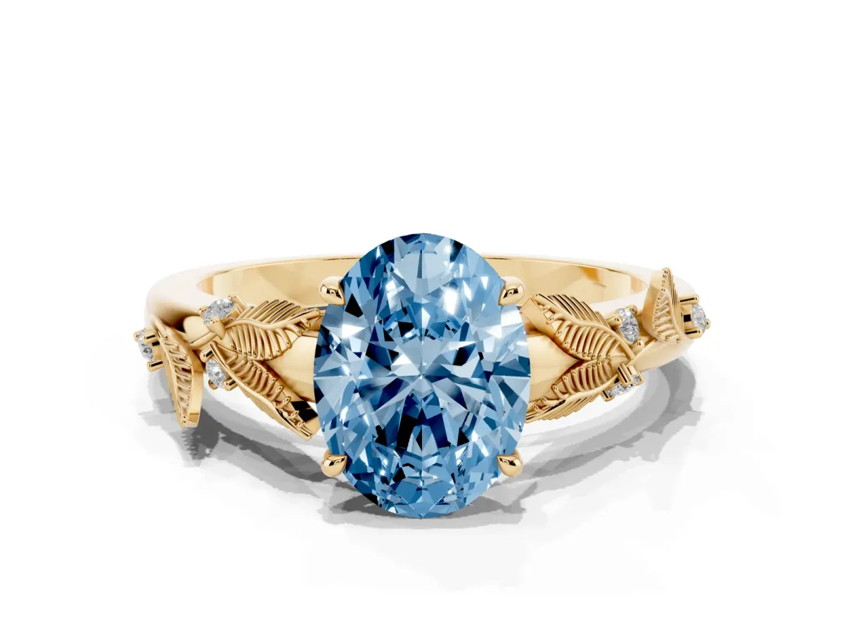 Fancy Blue Oval Cut Diamond Solitaire Ring with Leaf Motif Band and Four-Prong Setting Yellow gold
