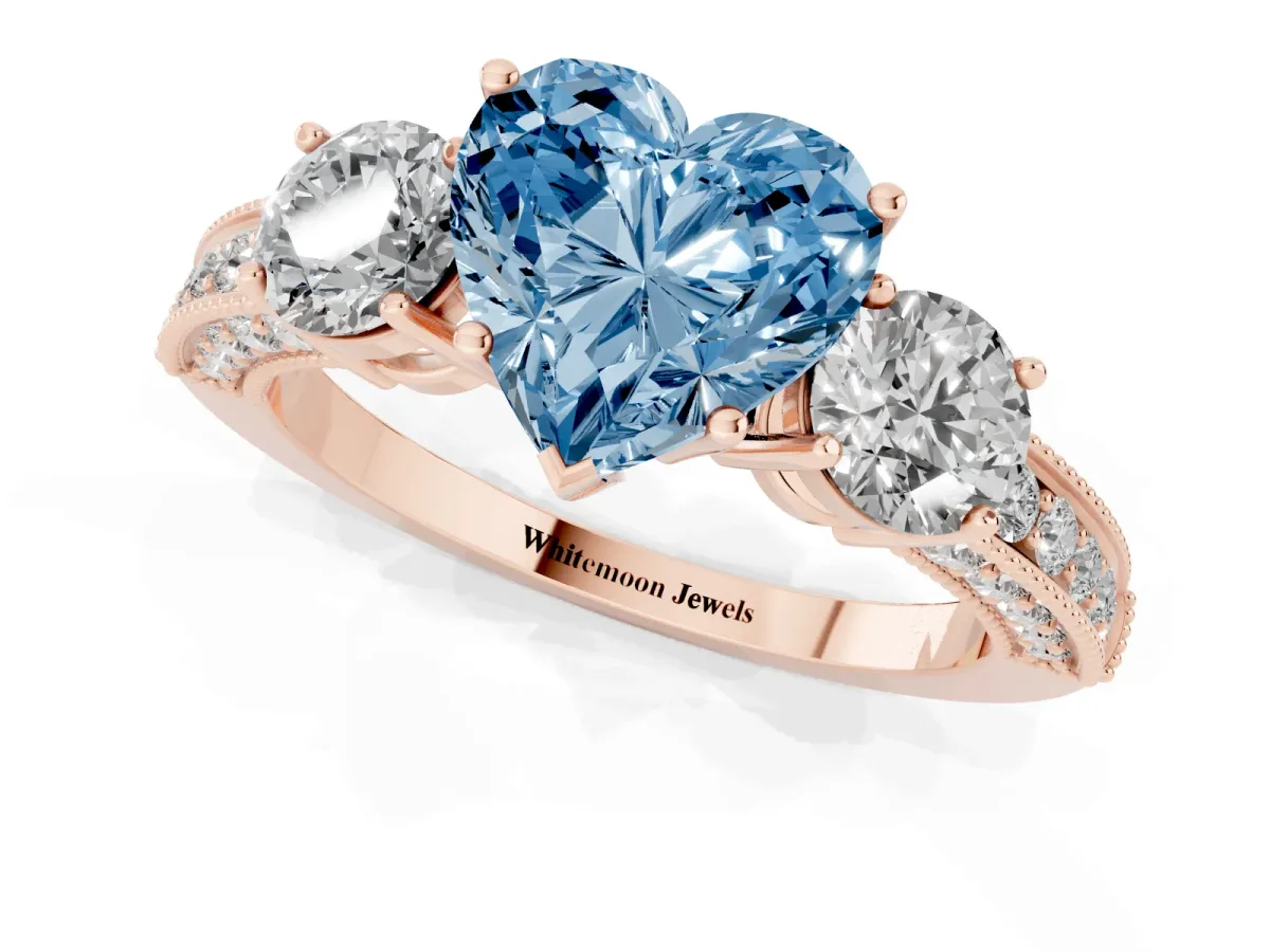 Fancy Blue Heart Cut Three-Stone Diamond Ring with Pavé Band and Four-Prong Setting Rose gold