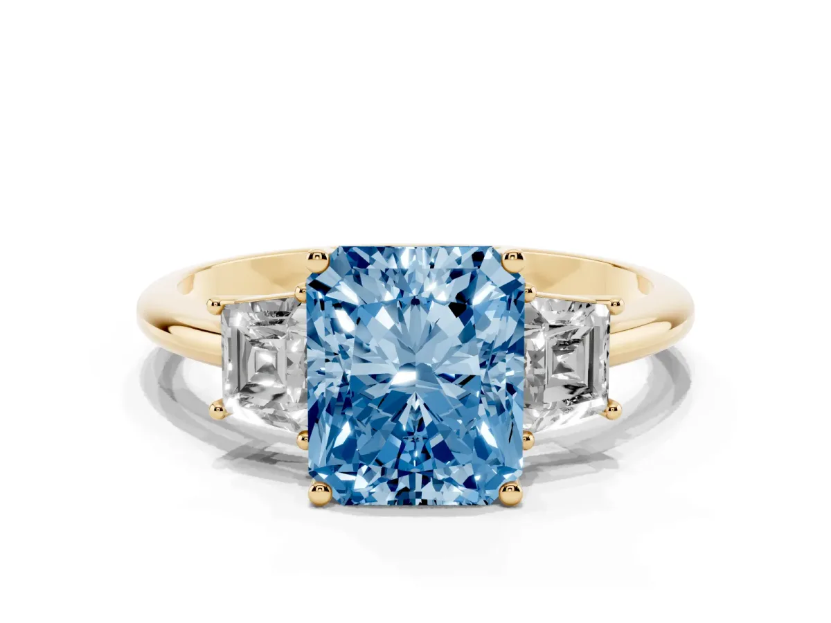Fancy Blue Radiant Cut Diamond Three-Stone Ring with Trapezoid Side Stones and Prong Setting Yellow gold