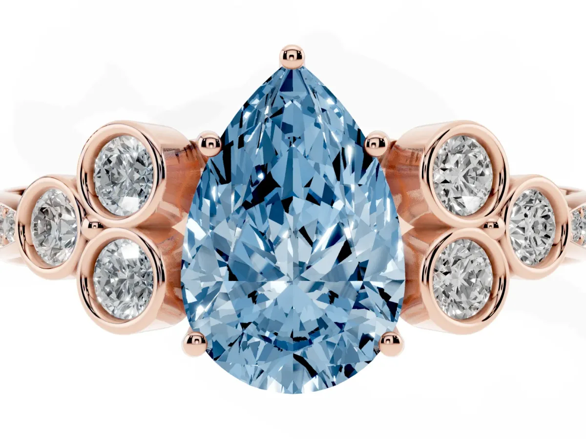 Fancy Blue Pear Cut Cut Diamond Engagement Ring with Bezel Set Round Side Stones and Prong Setting Rose gold