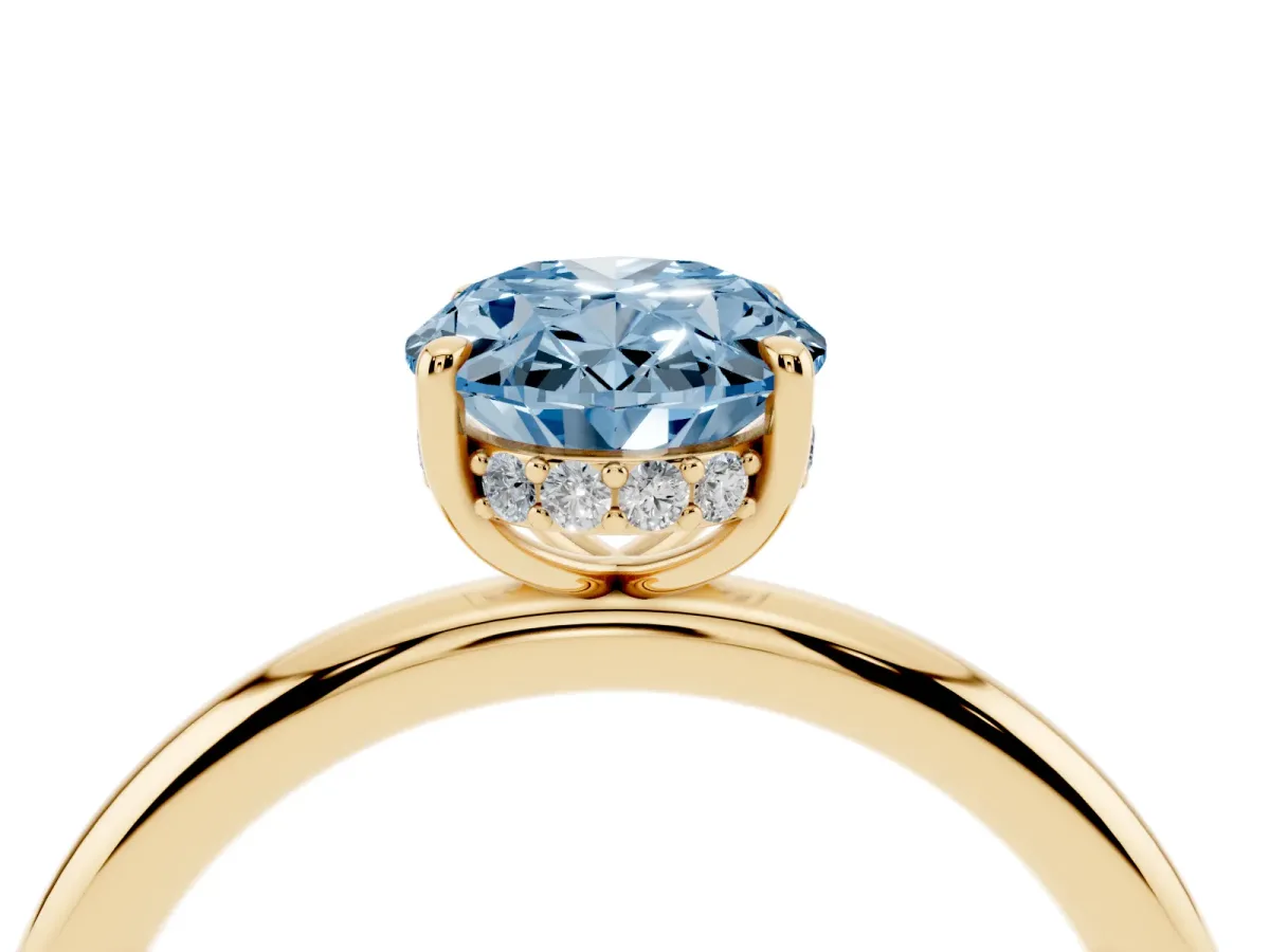 Fancy Blue Oval Cut Diamond Solitaire Ring with Thin Band and Four-Prong Setting Yellow gold