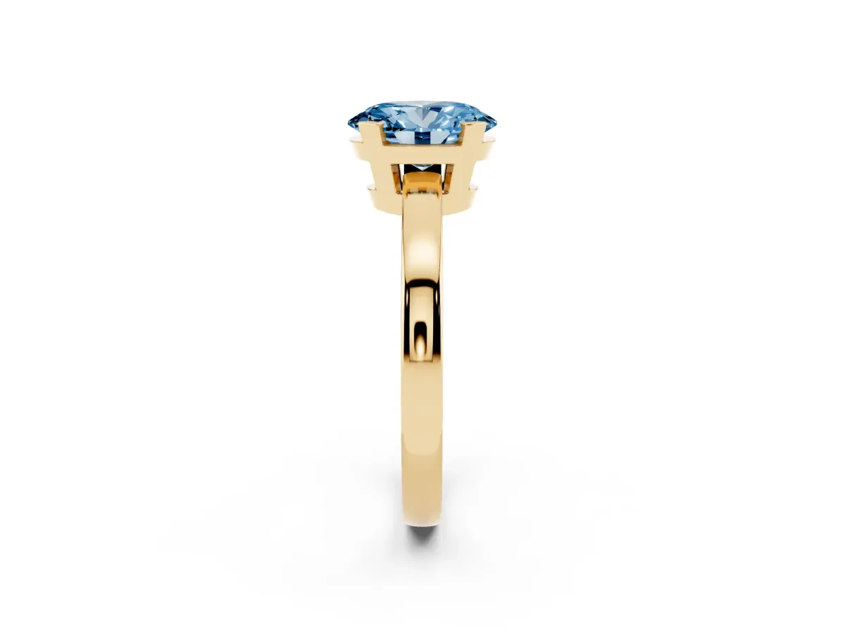 Fancy Blue Oval Cut Cut Solitaire Ring with Four-Prong Setting and Classic Band Yellow gold