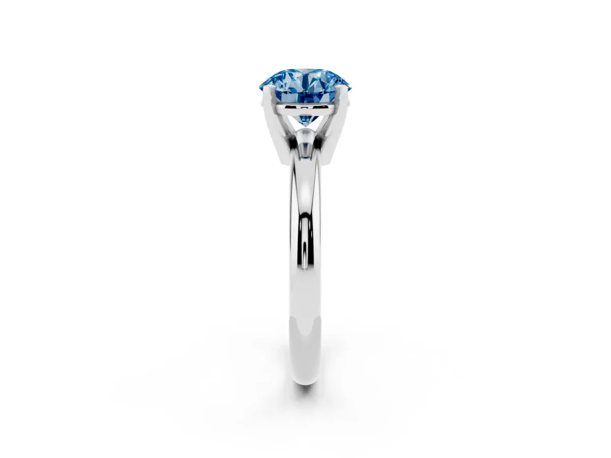 Fancy Blue Round Cut Diamond Solitaire Engagement Ring with Round Band and Four-Prong Setting Silver