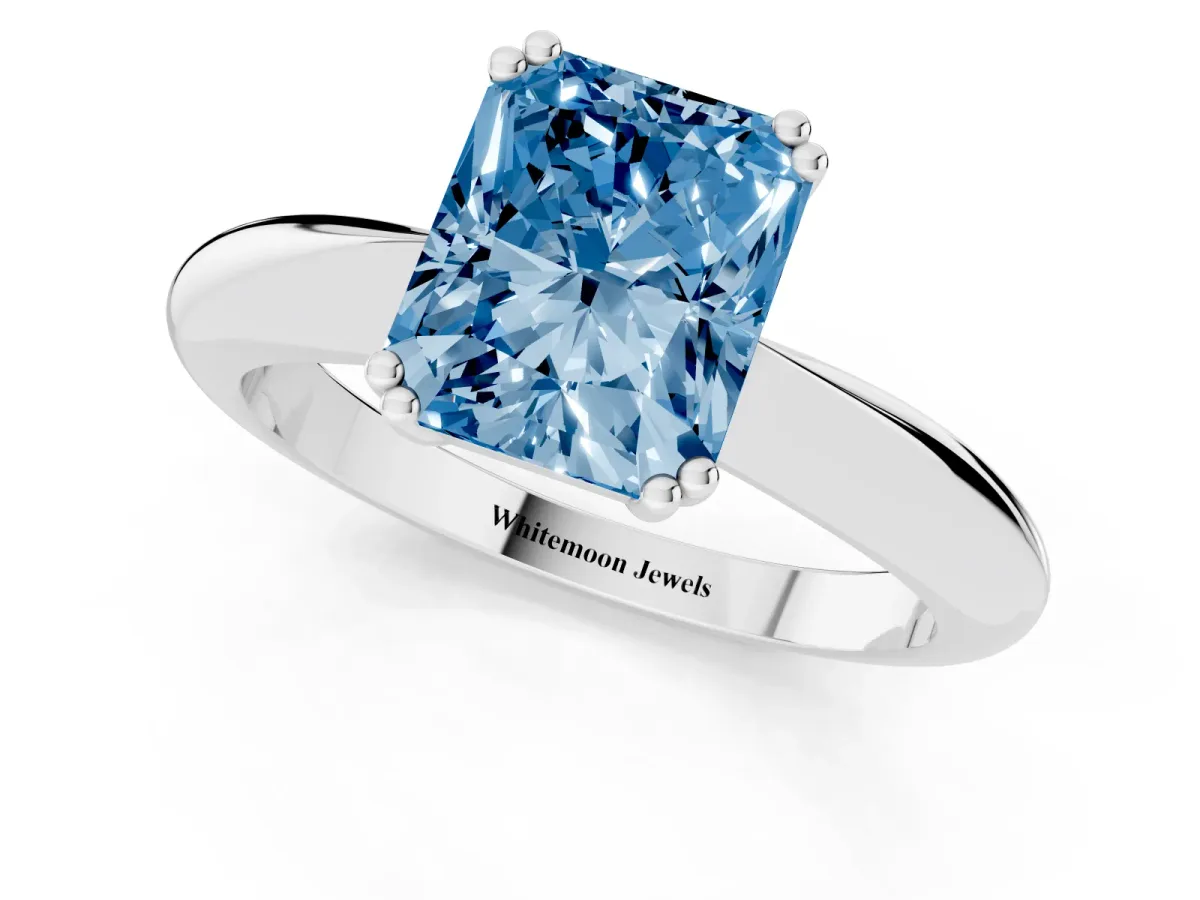 Fancy Blue Radiant Cut Cut Solitaire Engagement Ring with Tapered Band and Four-Prong Setting White gold