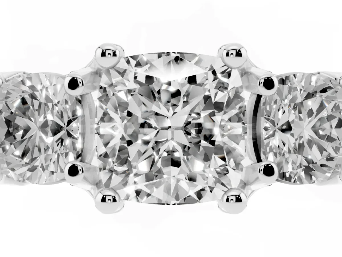Cushion Cut Diamond Three-Stone Ring with Channel Set Band and Four-Prong Setting Silver