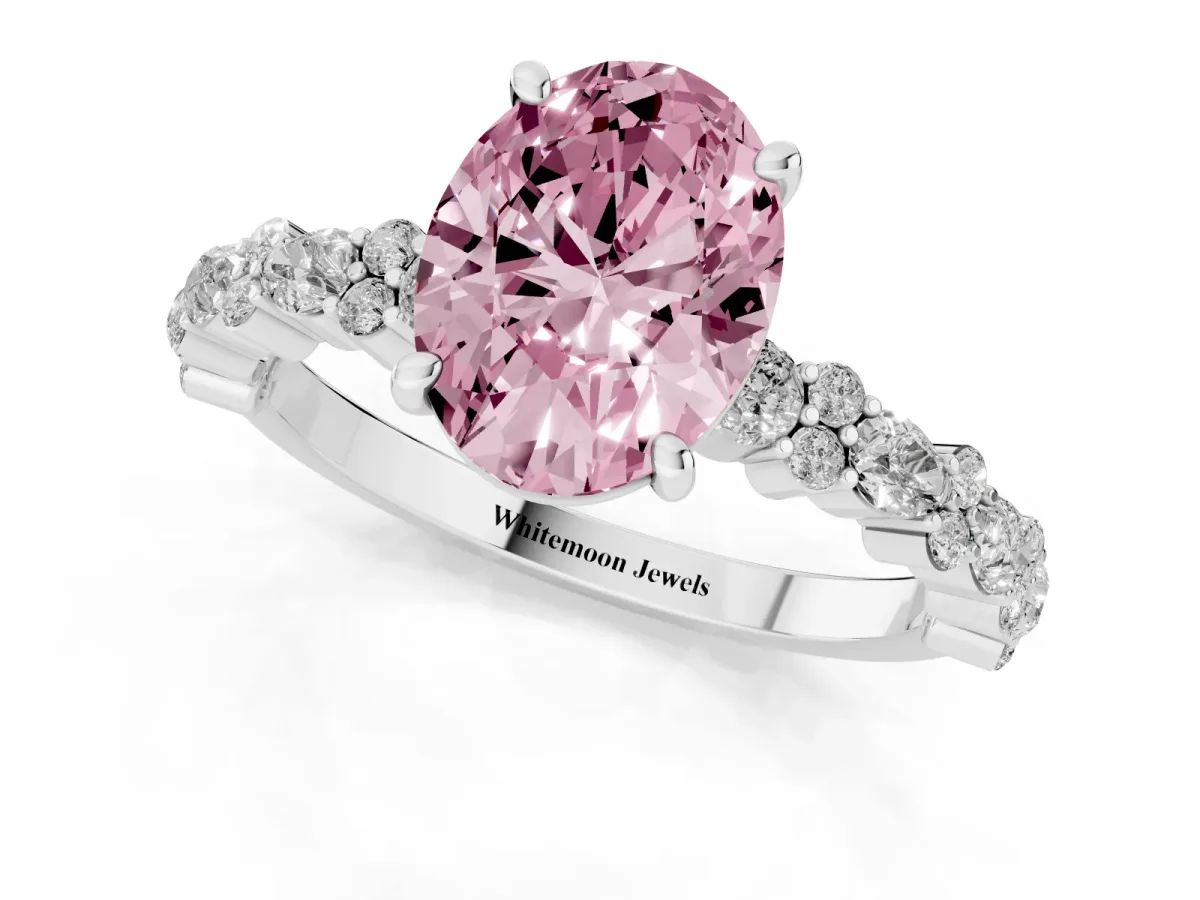 Fancy Pink Oval Cut Diamond Side Stone Solitaire Ring with Round and Four-Prong Setting Platinum