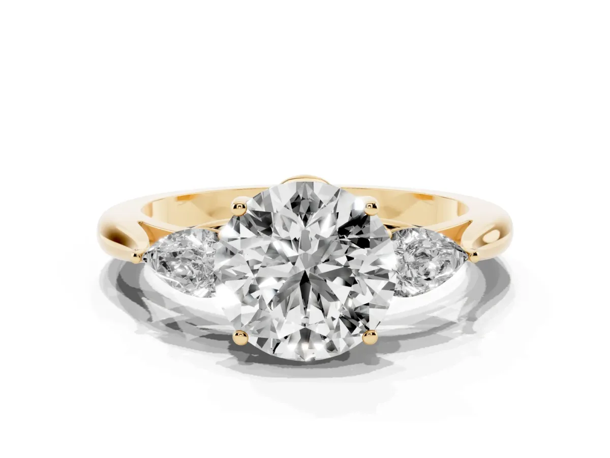 Round Cut Diamond Three-Stone Ring with Pear Side Stones and Prong Setting Yellow gold