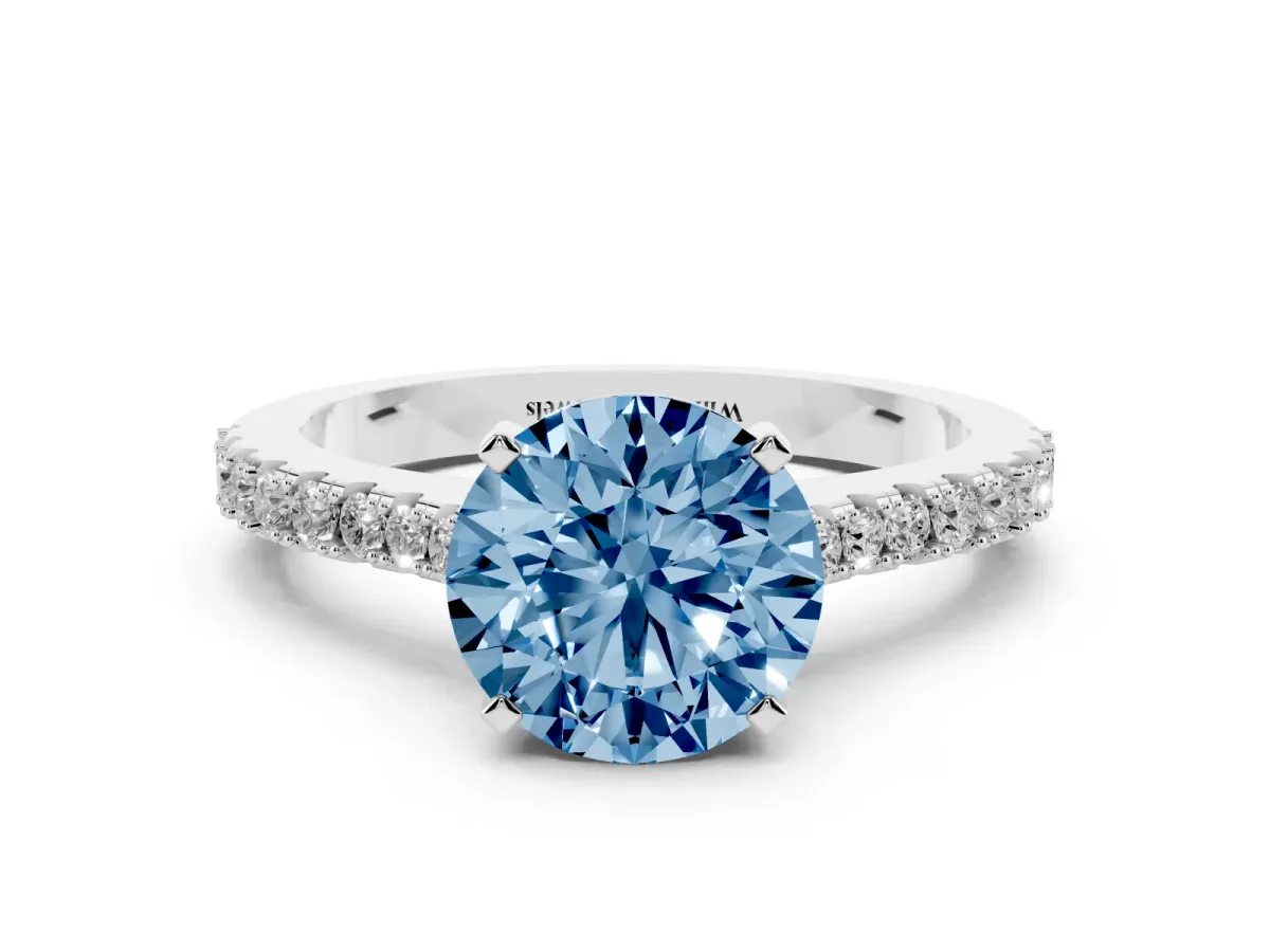 Fancy Blue Round Cut Cut Solitaire Diamond Engagement Ring with Pave Band and Four-Prong Setting Platinum