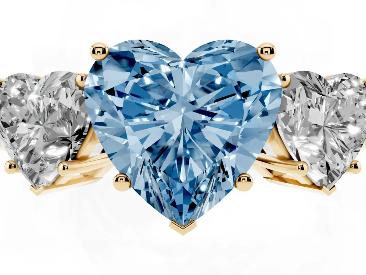 Fancy Blue Three-Stone Heart Cut Cut Diamond Engagement Ring with Flat Band and Four-Prong Setting Yellow gold