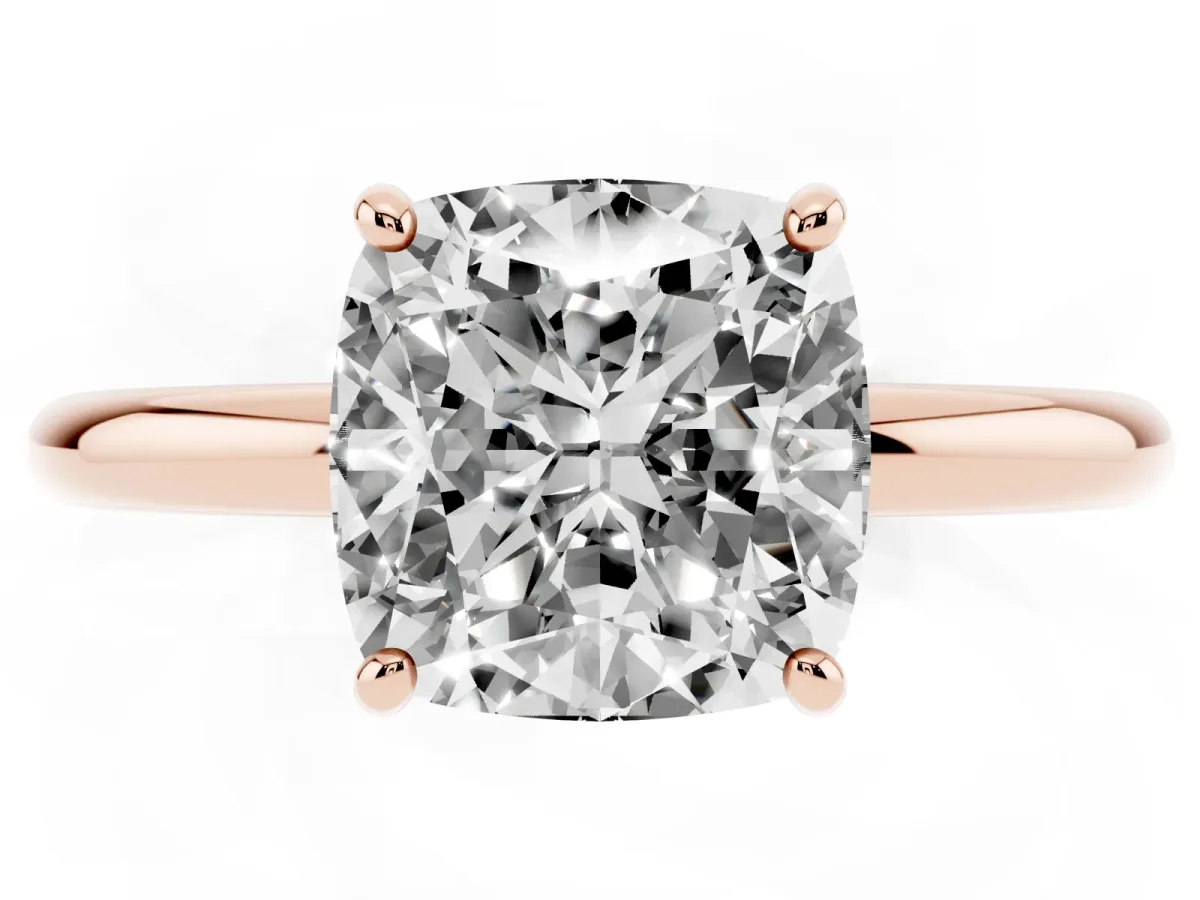 Cushion Cut Solitaire Diamond Ring with Four-Prong Setting on a Plain Band Rose gold