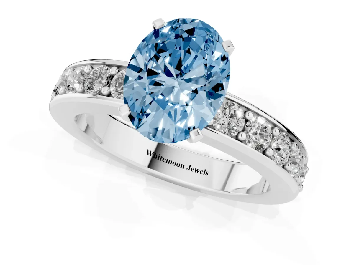Fancy Blue Oval Cut Diamond Engagement Ring with Channel Set Round Band and Prong Setting Silver