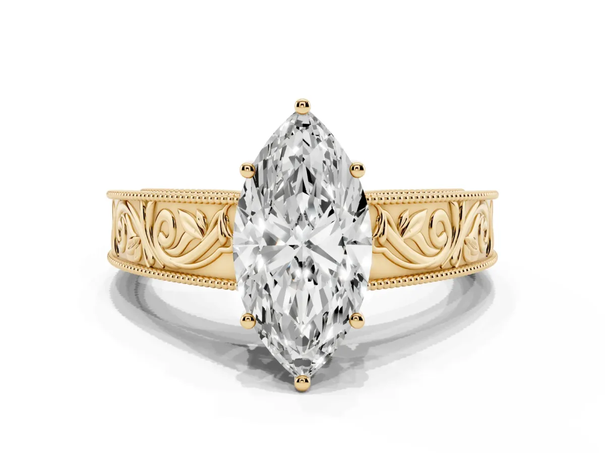 Marquise Cut Diamond Solitaire Ring with Engraved Band and Four-Prong Setting Yellow gold