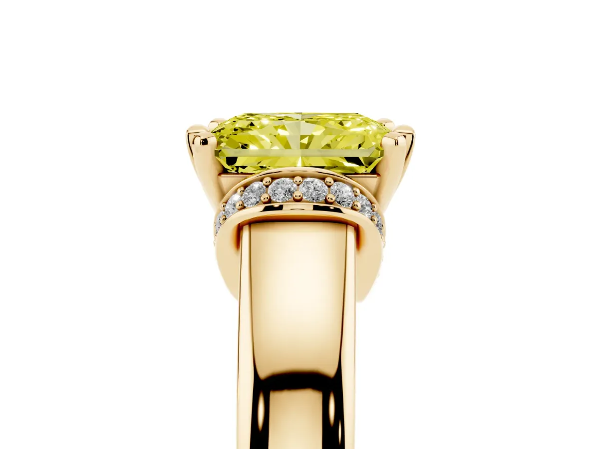 Fancy Yellow Radiant Cut Solitaire Diamond Ring with Pave Band and Six-Prong Setting Yellow gold