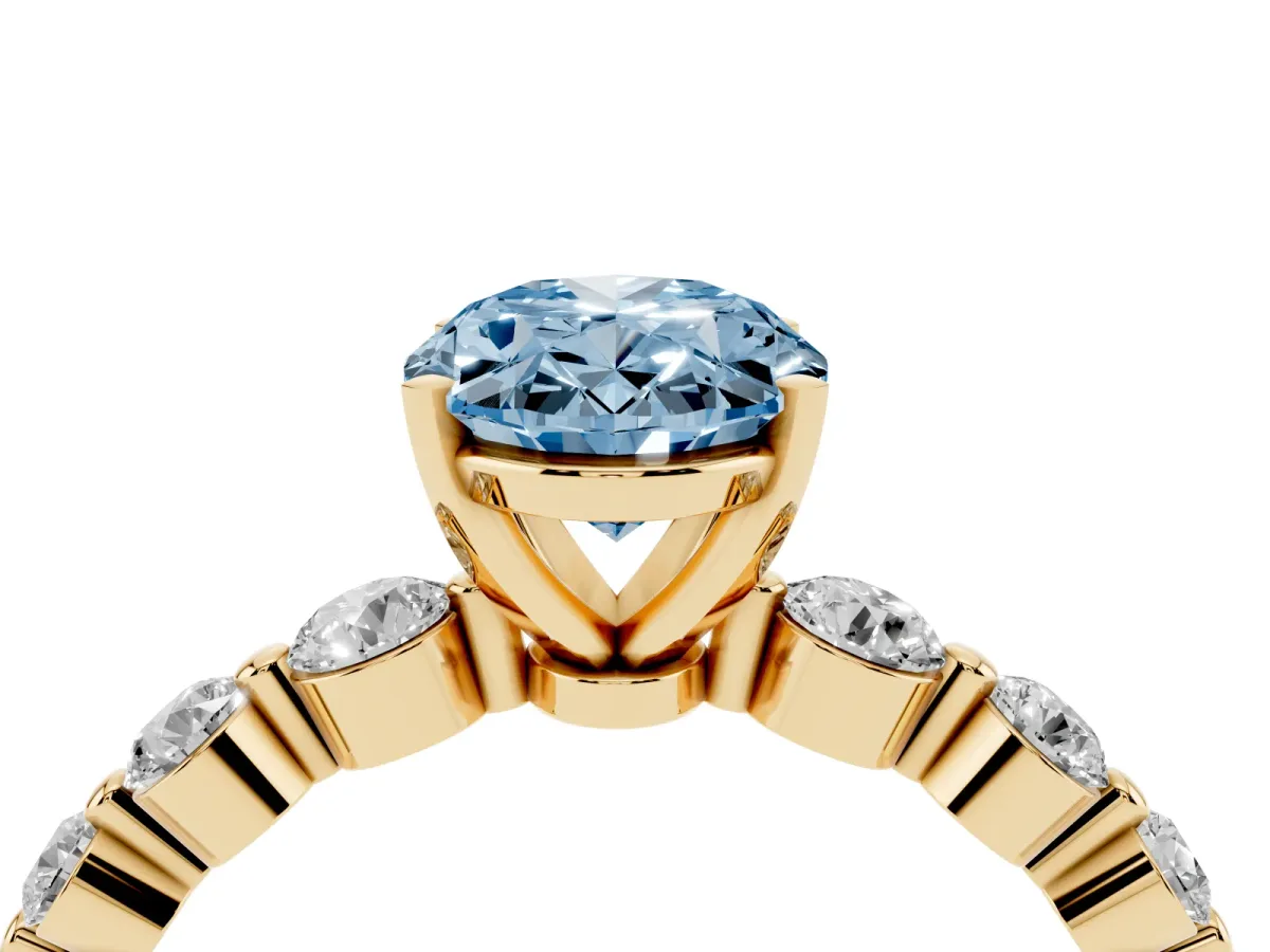 Fancy Blue Oval Cut Solitaire Diamond Ring with Pave Band and Four-Prong Setting Yellow gold