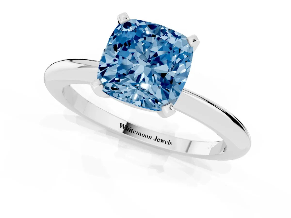 Fancy Blue Cushion Cut Diamond Solitaire Ring with Prong Setting and Classic Band Silver