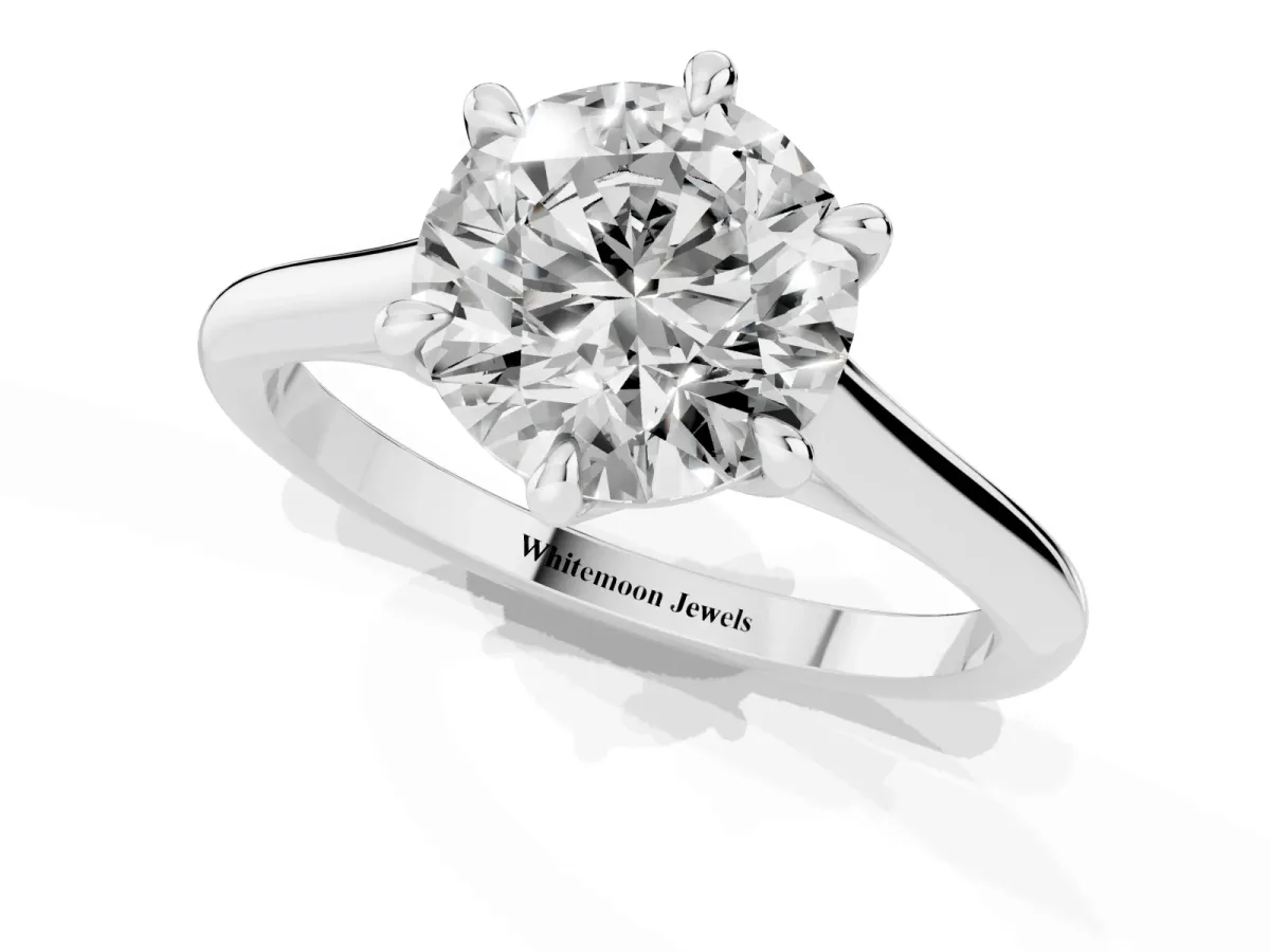 Round Cut Solitaire Engagement Ring with Six-Prong Setting and Classic Band Silver