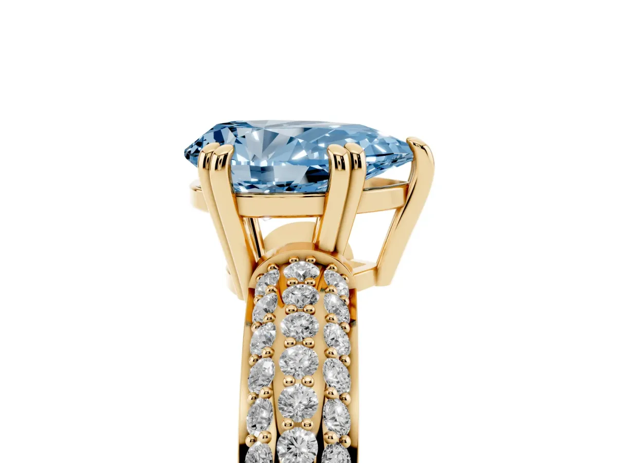 Fancy Blue Pear Cut Diamond Solitaire Ring with Multi-Row Round Pavé Band and Prong Setting Yellow gold