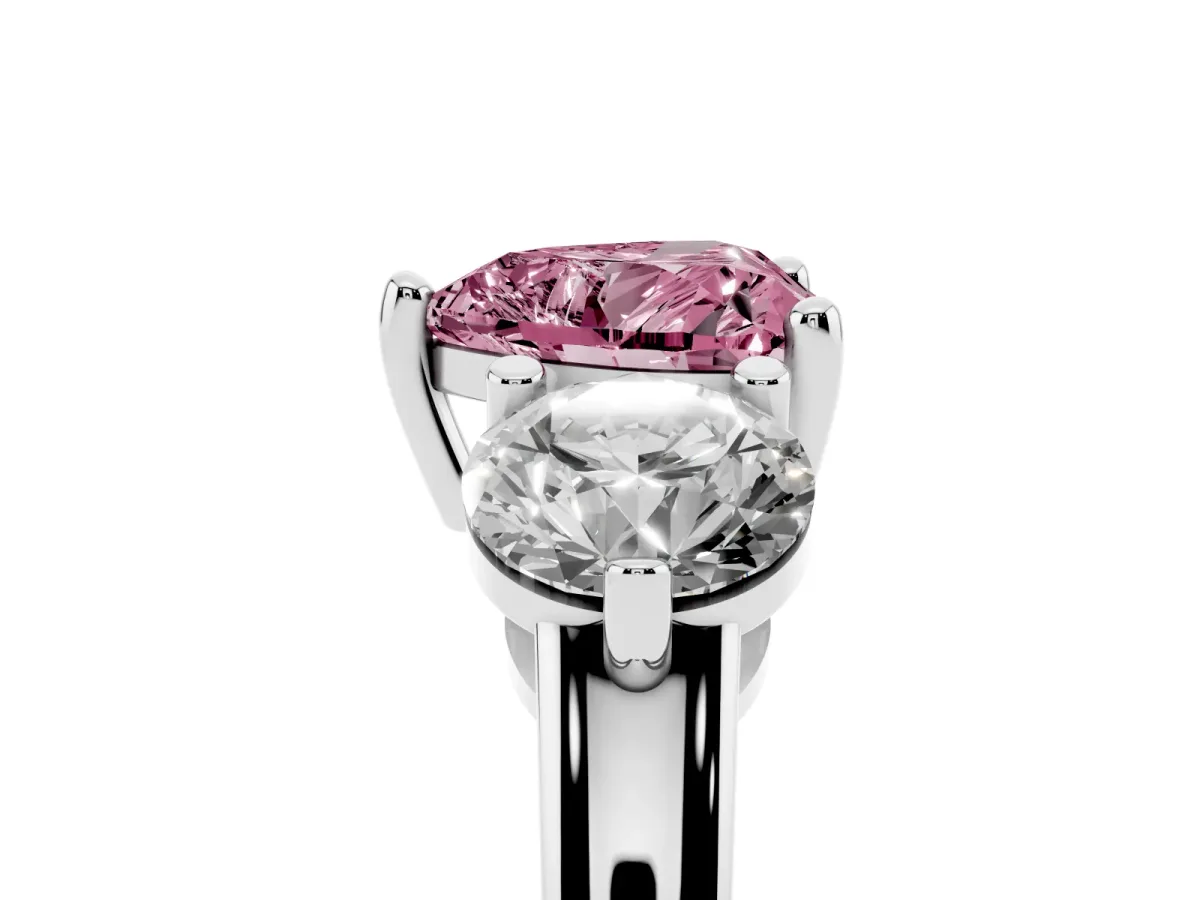 Fancy Pink Three-Stone Heart Cut Brilliant Cut Solitaire Ring with Prong Setting on a Classic Band White gold