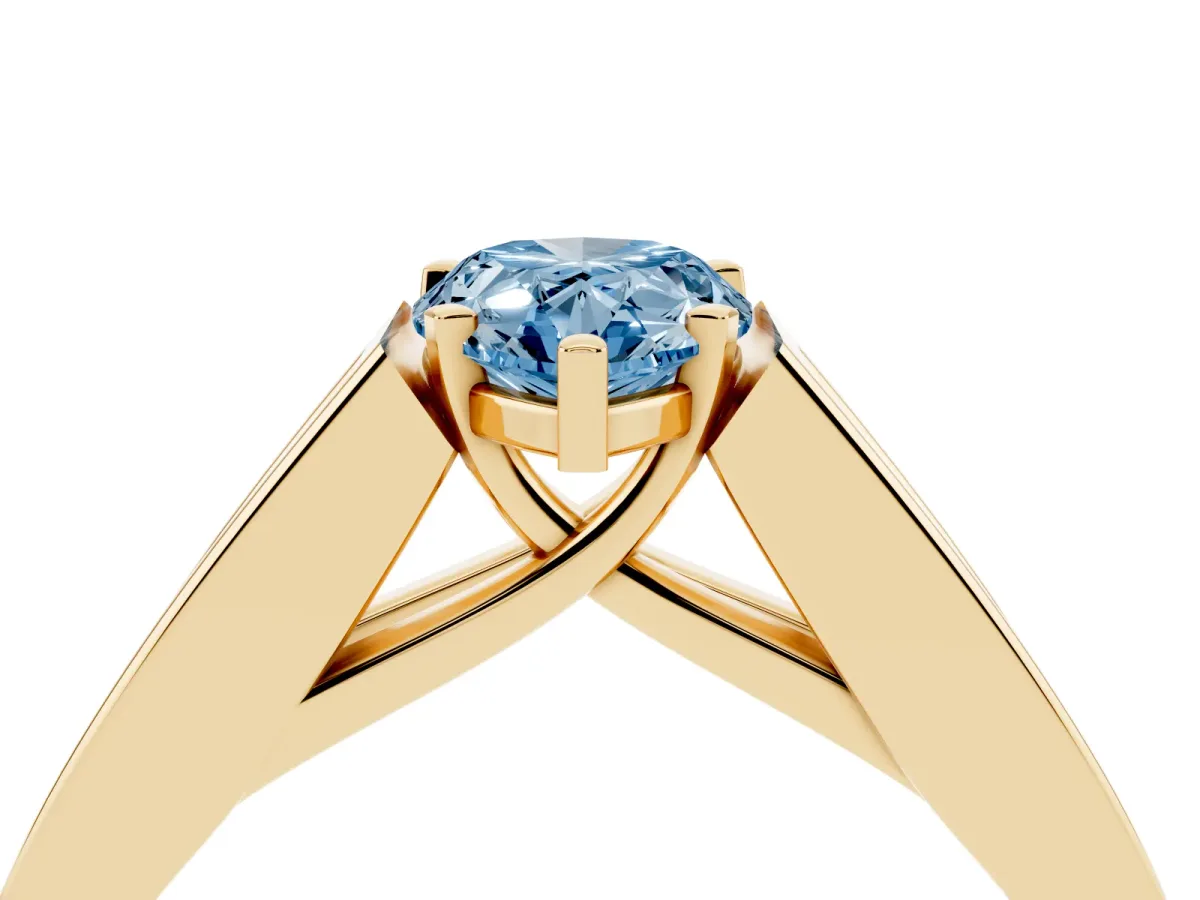 Fancy Blue Pear Cut Cut Channel Set Solitaire Ring with Four-Prong Setting Yellow gold