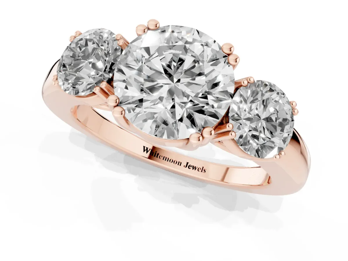 Three-Stone Round Cut Cut Diamond Ring with Channel Set Band and Four-Prong Setting Rose gold