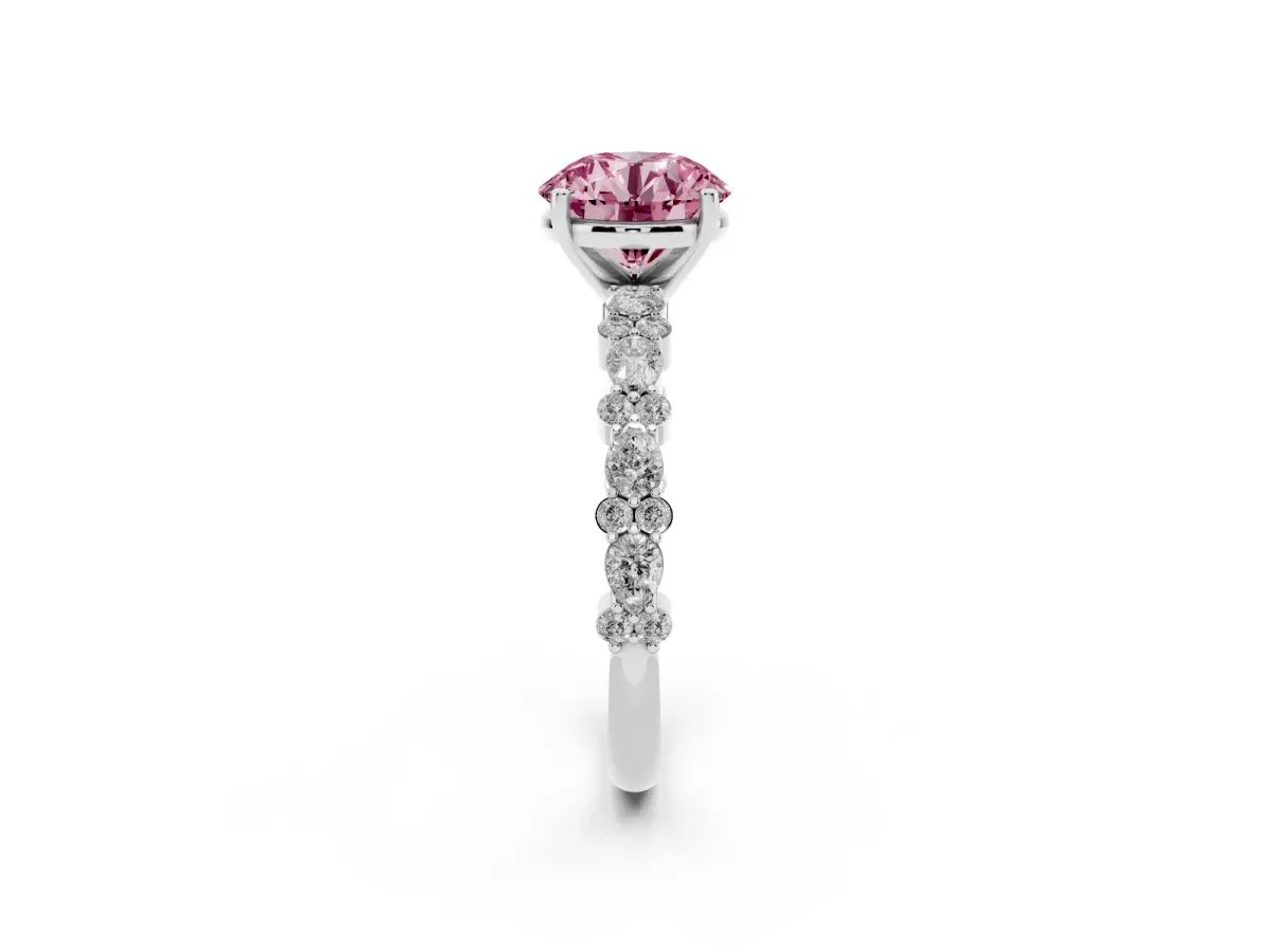 Fancy Pink Round Cut Diamond Side Stone Solitaire Ring with Round and Four-Prong Setting Platinum