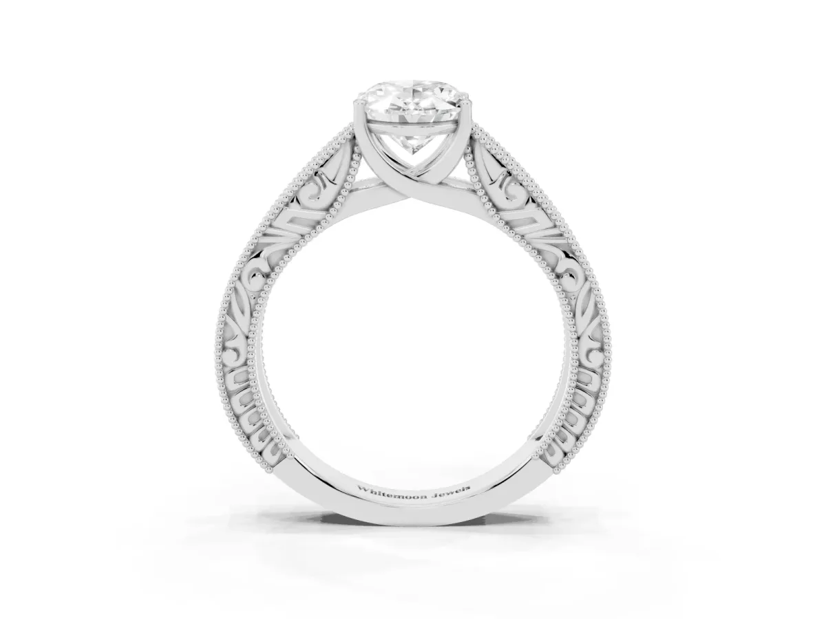 Oval Cut Diamond Solitaire Ring with Engraved Band and Four-Prong Setting Silver