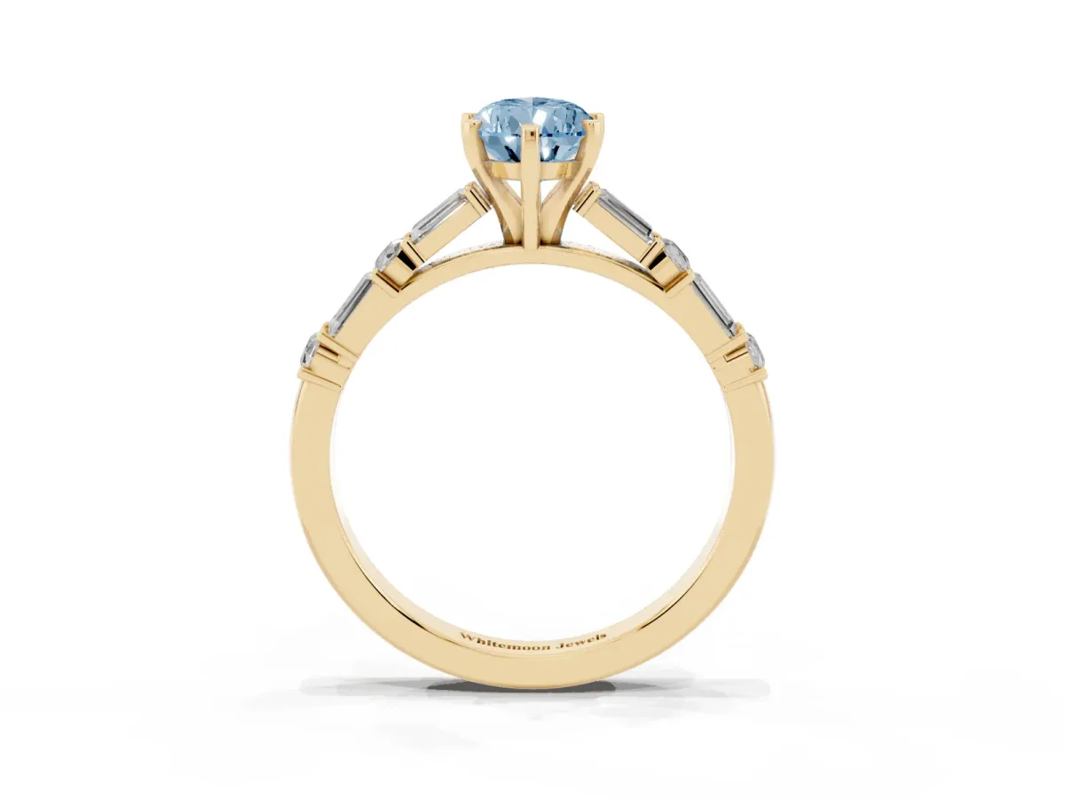 Fancy Blue Pear Cut Diamond Solitaire with Side Baguettes and Channel Set Band Yellow gold