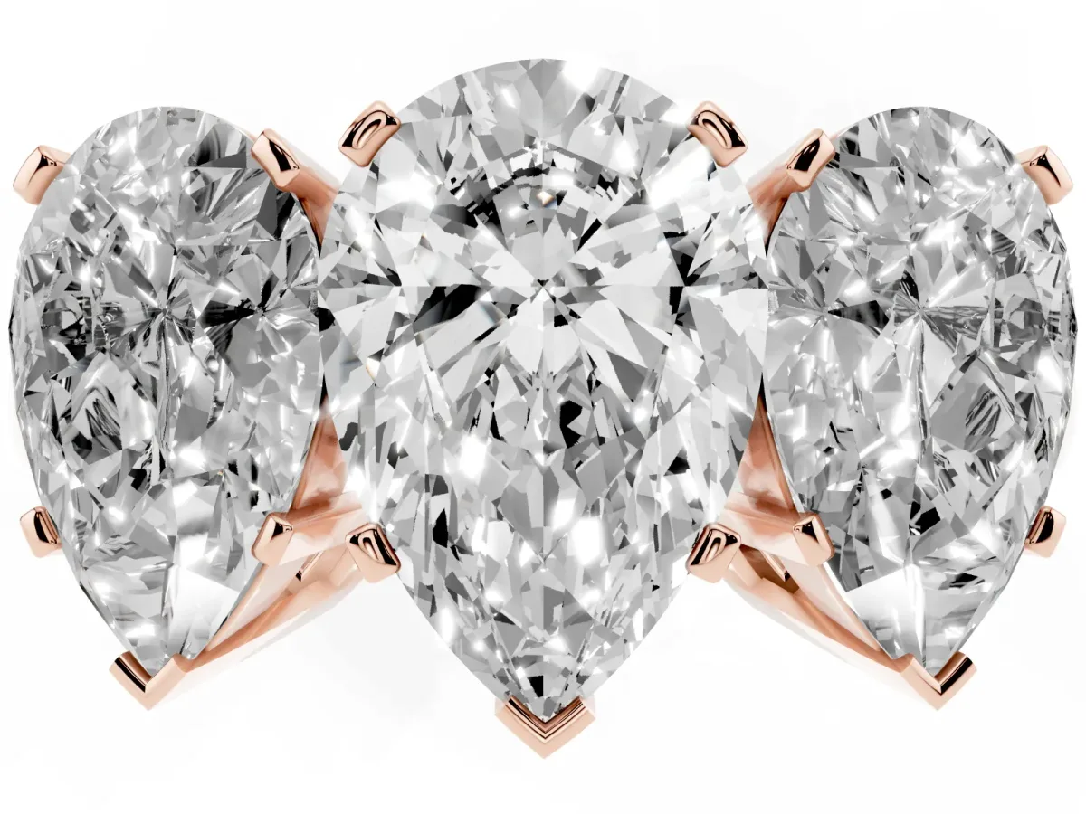 Three-Stone Pear Cut Cut Diamond Ring with Channel Set Band and Four-Prong Setting Rose gold