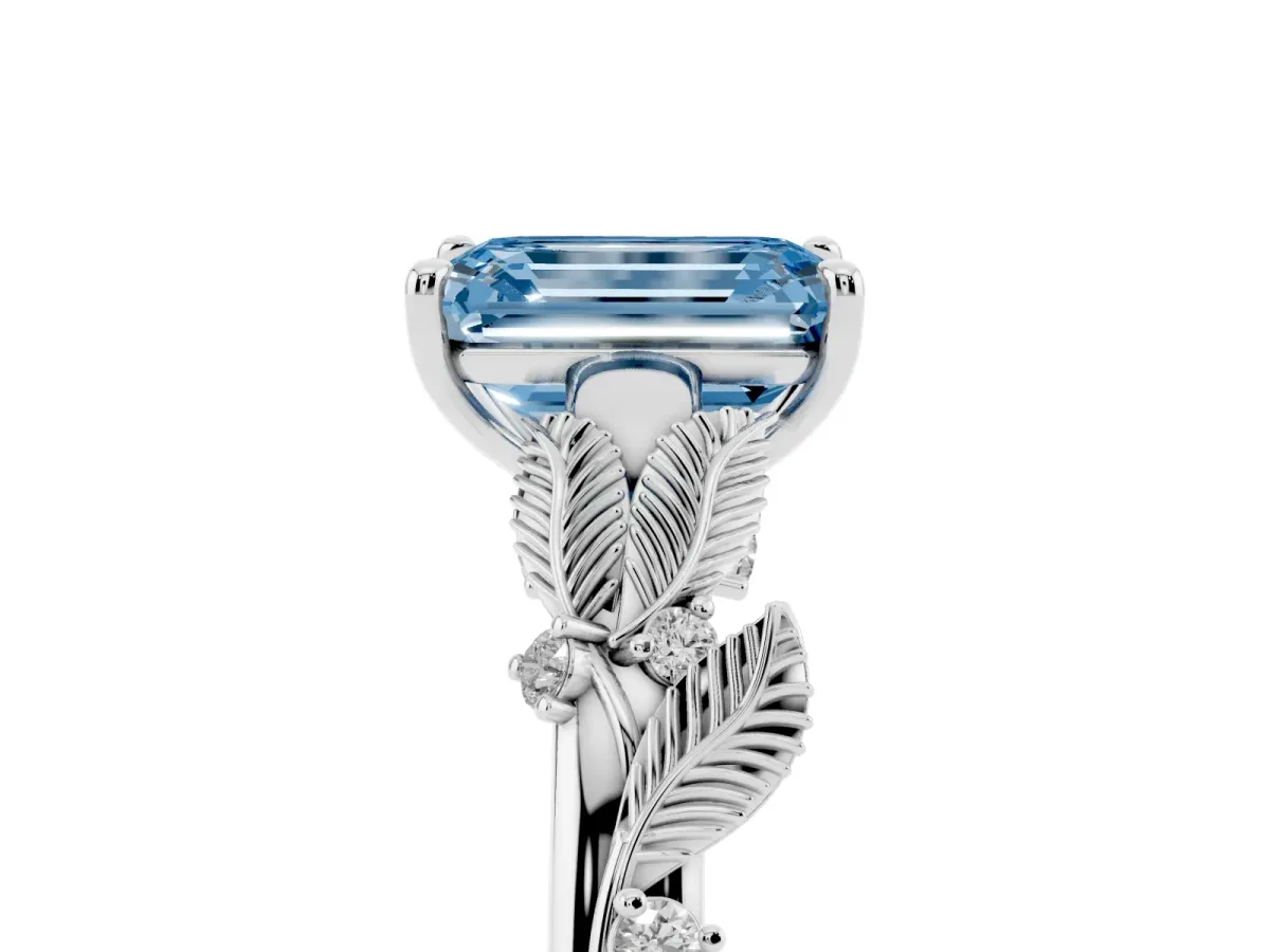Fancy Blue Emerald Cut Diamond Solitaire Ring with Leaf Motif Band and Four-Prong Setting Silver