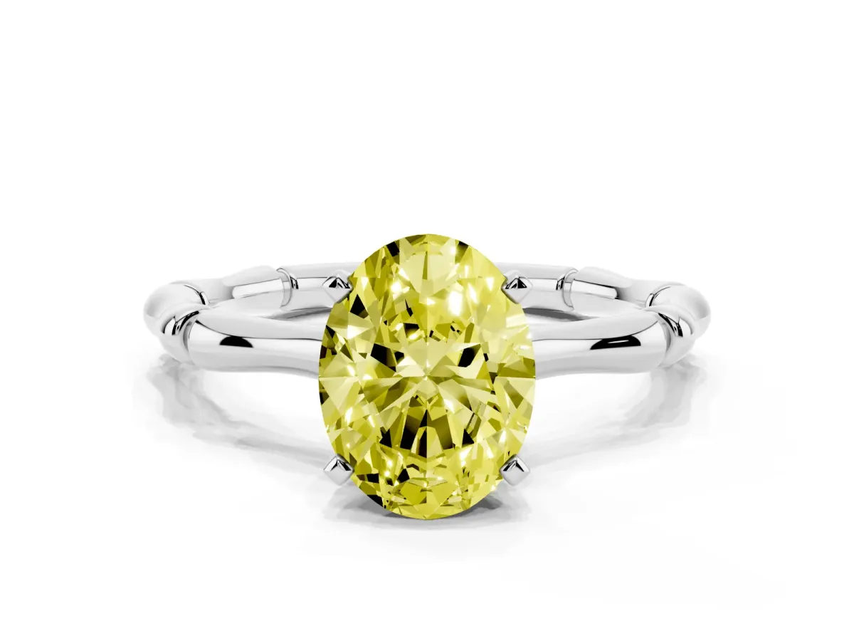 Fancy Yellow Oval Cut Solitaire Diamond Ring with Bamboo Band and Four-Prong Setting Silver