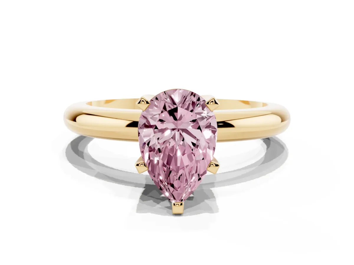 Fancy Pink Pear Cut Diamond Solitaire Engagement Ring with Round Band and Four-Prong Setting Yellow gold