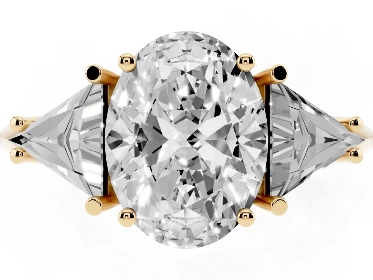 Three-Stone Oval Cut Diamond Engagement Ring with Trillion Side Stones and Prong Setting Yellow gold