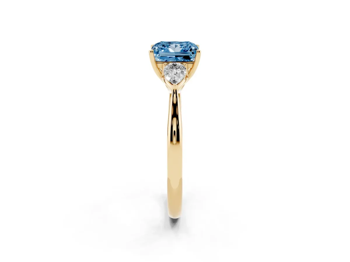 Fancy Blue Princess Cut Diamond Three-Stone Ring with Pear Side Stones and Prong Setting Yellow gold