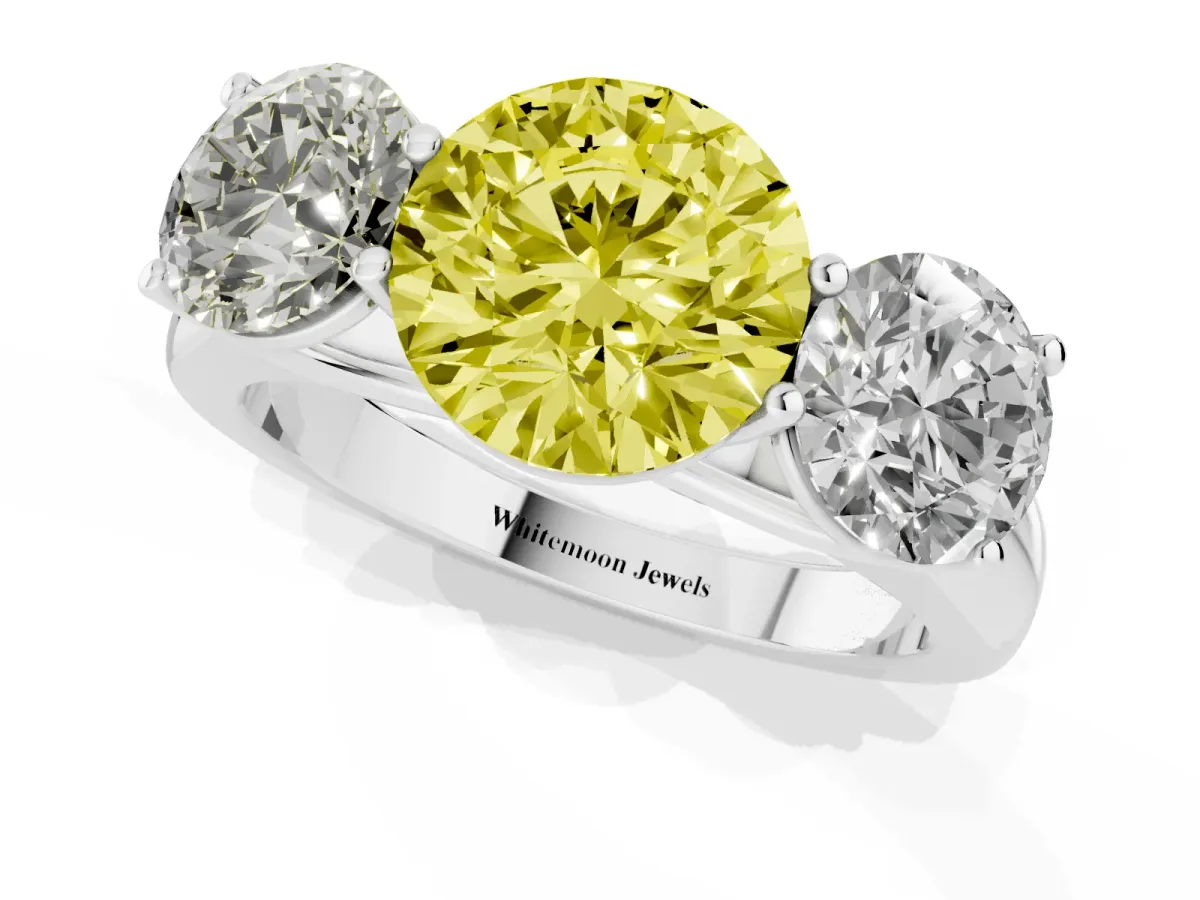 Fancy Yellow Round Cut Three-Stone Diamond Ring with Prong Setting on a Classic Band Silver