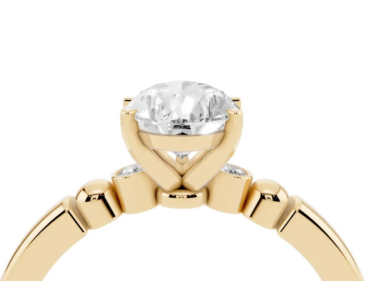 Pear Cut Solitaire Beaded Band with Four-Prong Setting Yellow gold