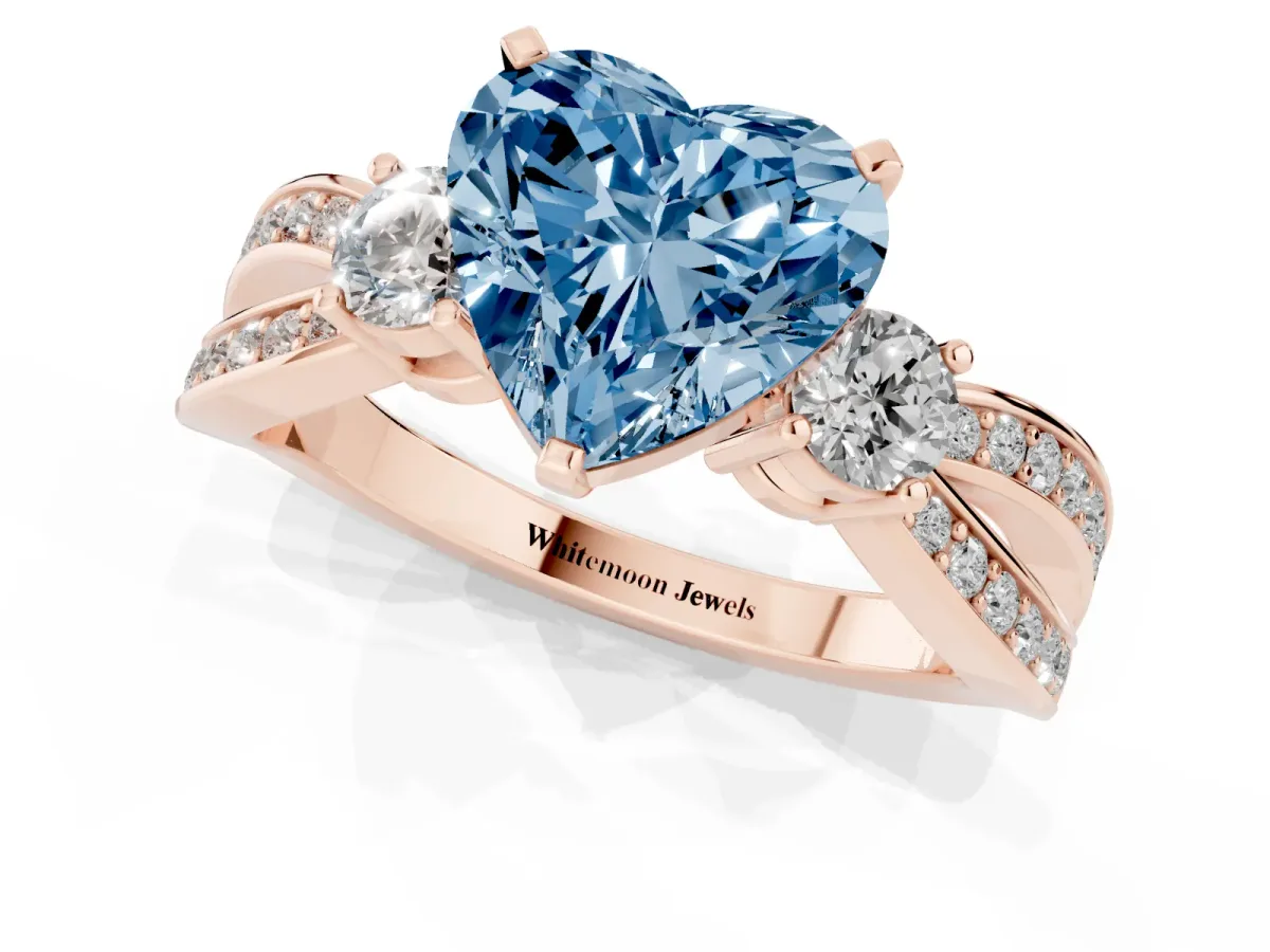 Fancy Blue Three-Stone Heart Cut Cut Diamond Twist Band with Prong Setting Rose gold