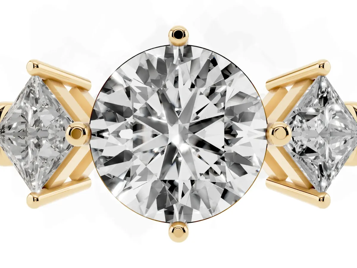 Three-Stone Round Cut and Princess Cut Diamond Ring with Channel Band and Four-Prong Setting Yellow gold