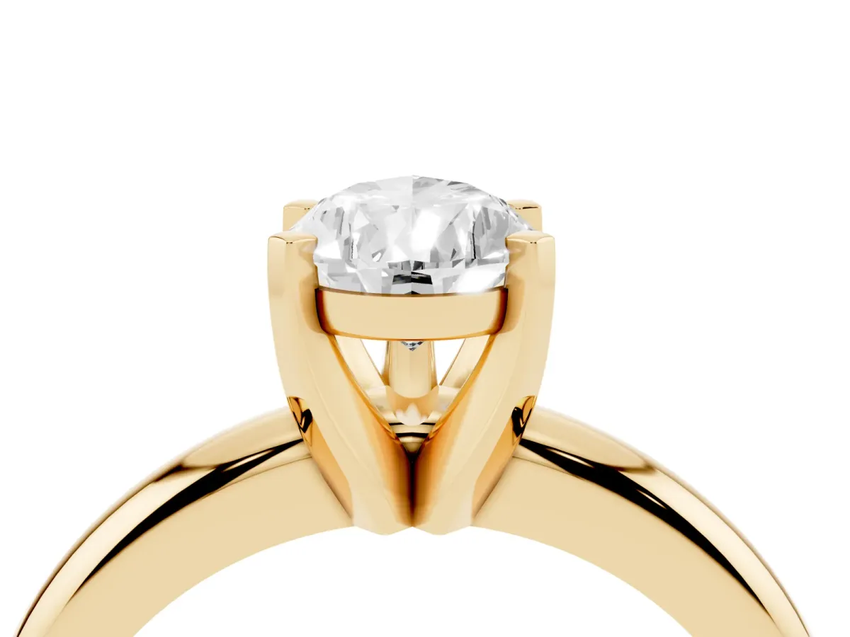 Pear Cut Diamond Solitaire Engagement Ring with Round Band and Four-Prong Setting Yellow gold