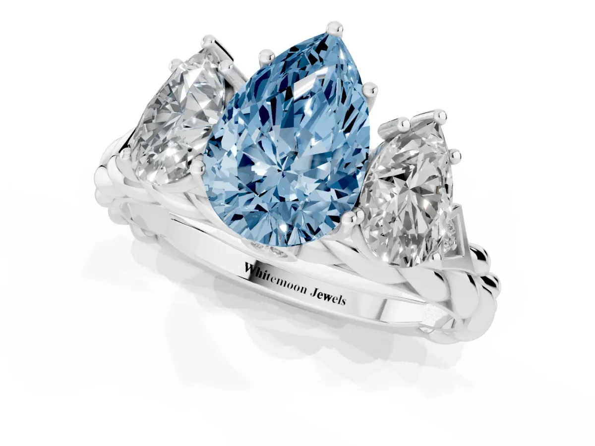 Fancy Blue Three-Stone Pear Cut Diamond Braided Band Ring with Four-Prong Setting Platinum