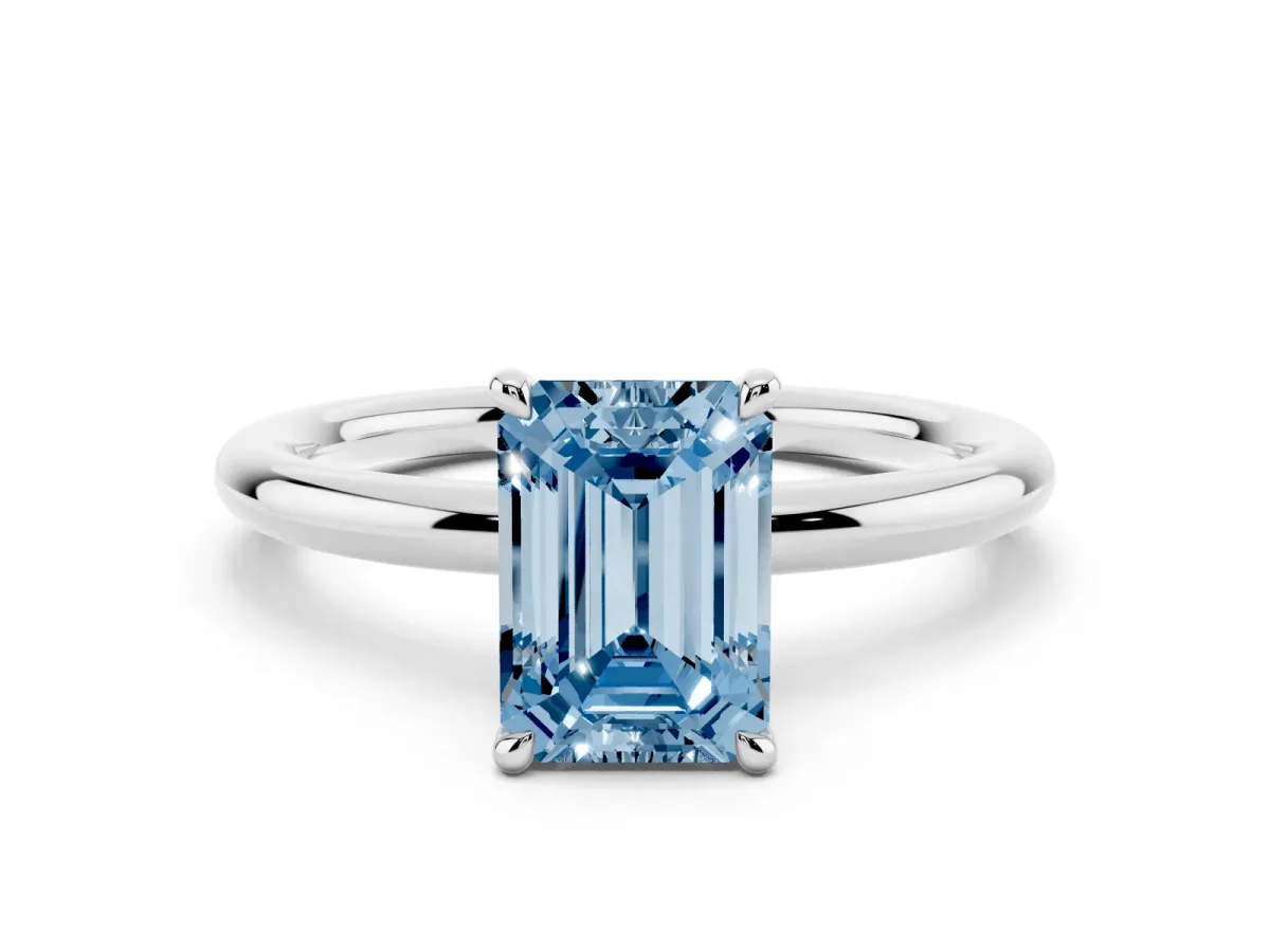 Fancy Blue Emerald Cut Diamond Solitaire Ring with Thin Band and Four-Prong Setting Silver