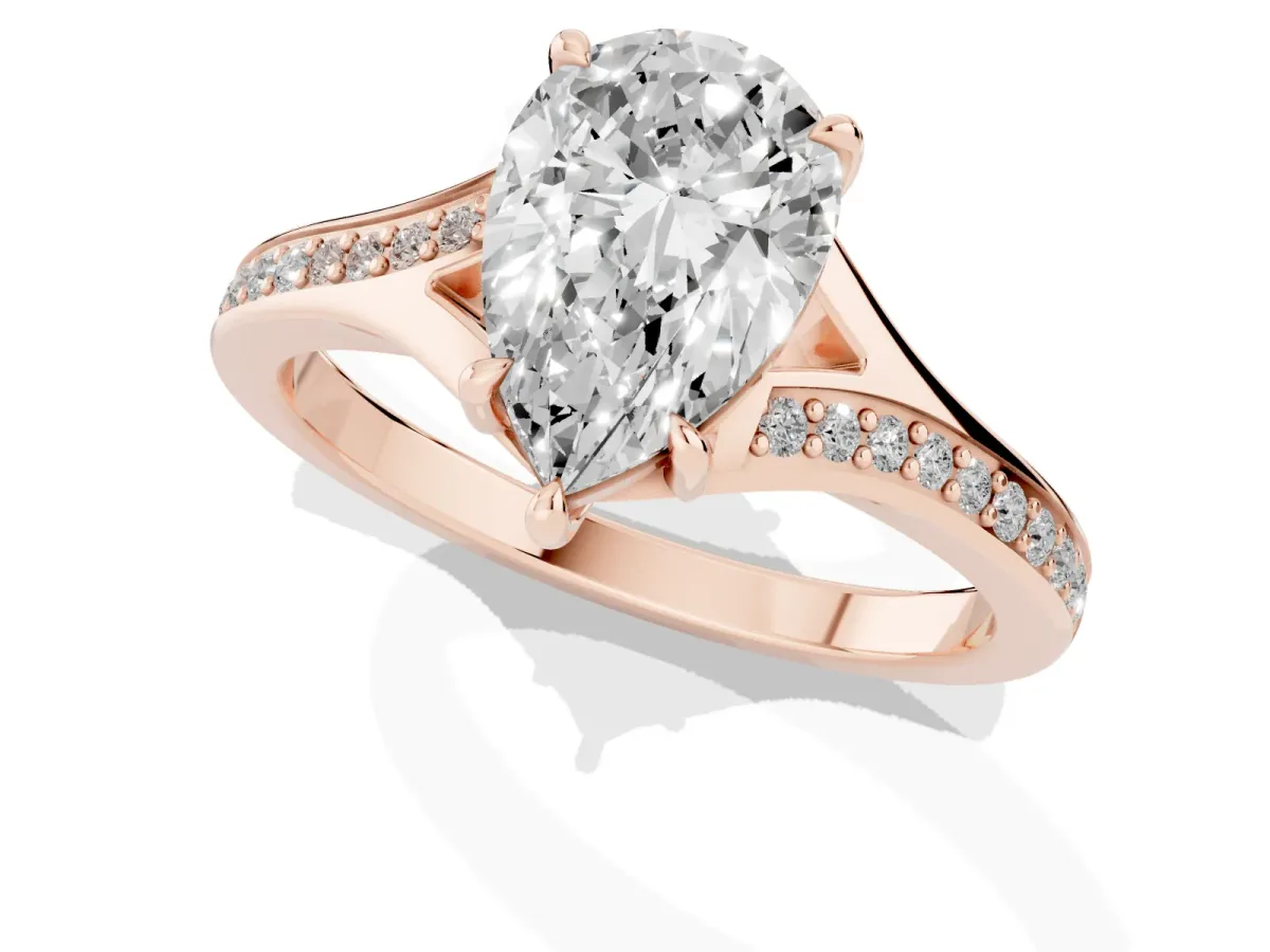 Pear Cut Diamond Solitaire Ring with Pavé Band and Prong Setting Rose gold